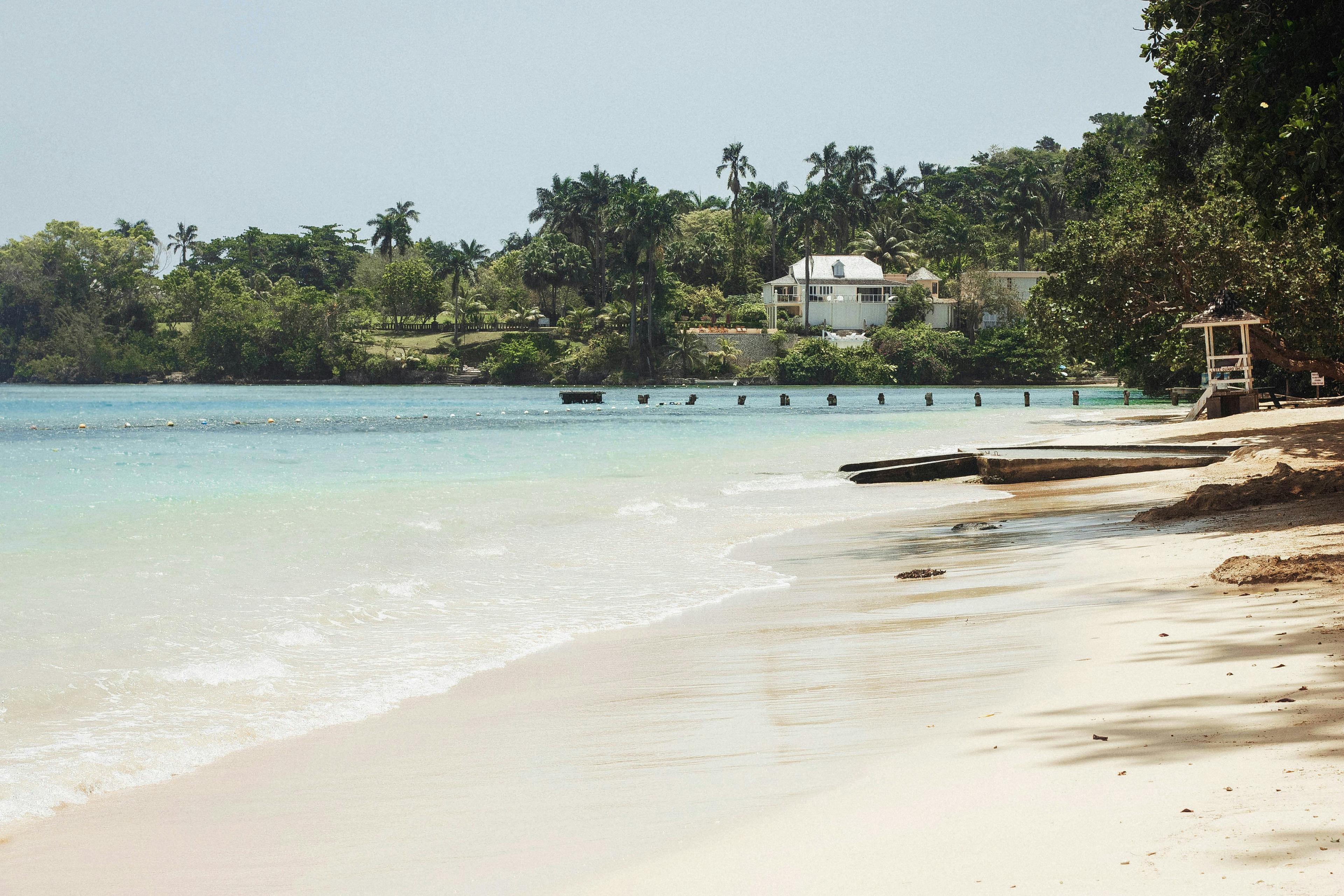 Tropical beach in Philippines with white sand, turquoise water, and palm trees
