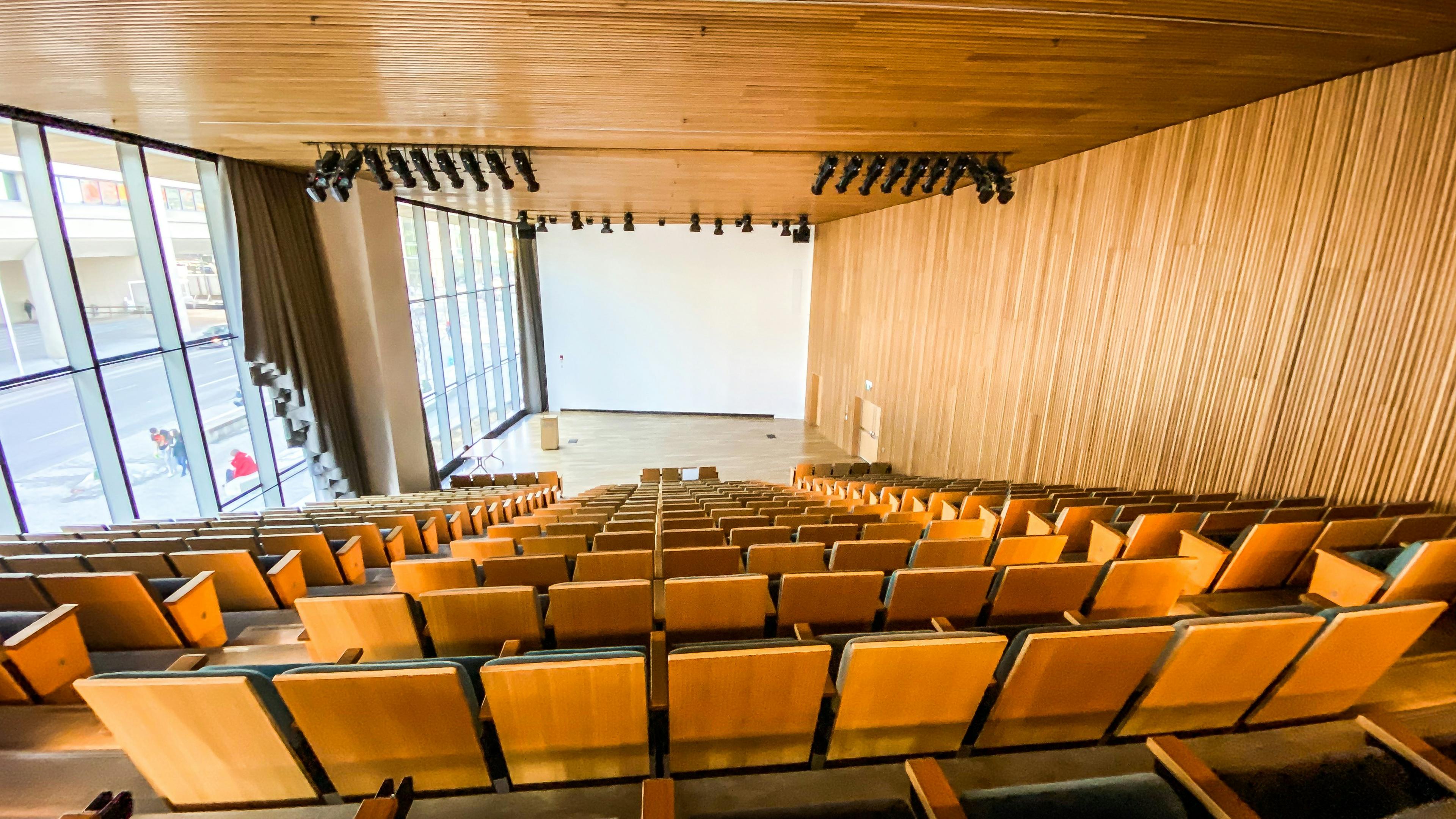 University lecture hall with modern seating and presentation screen