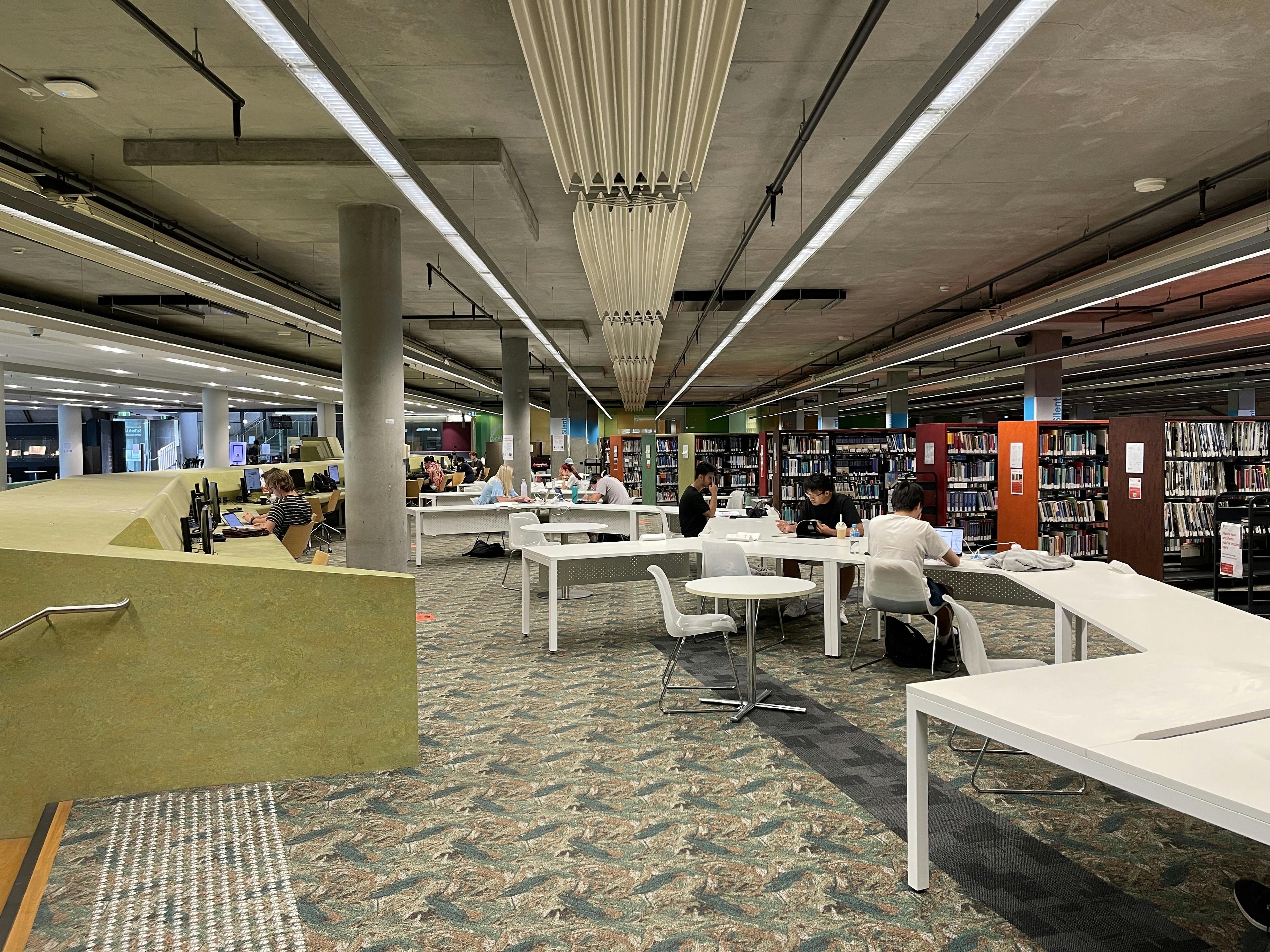 Students studying together in modern university library
