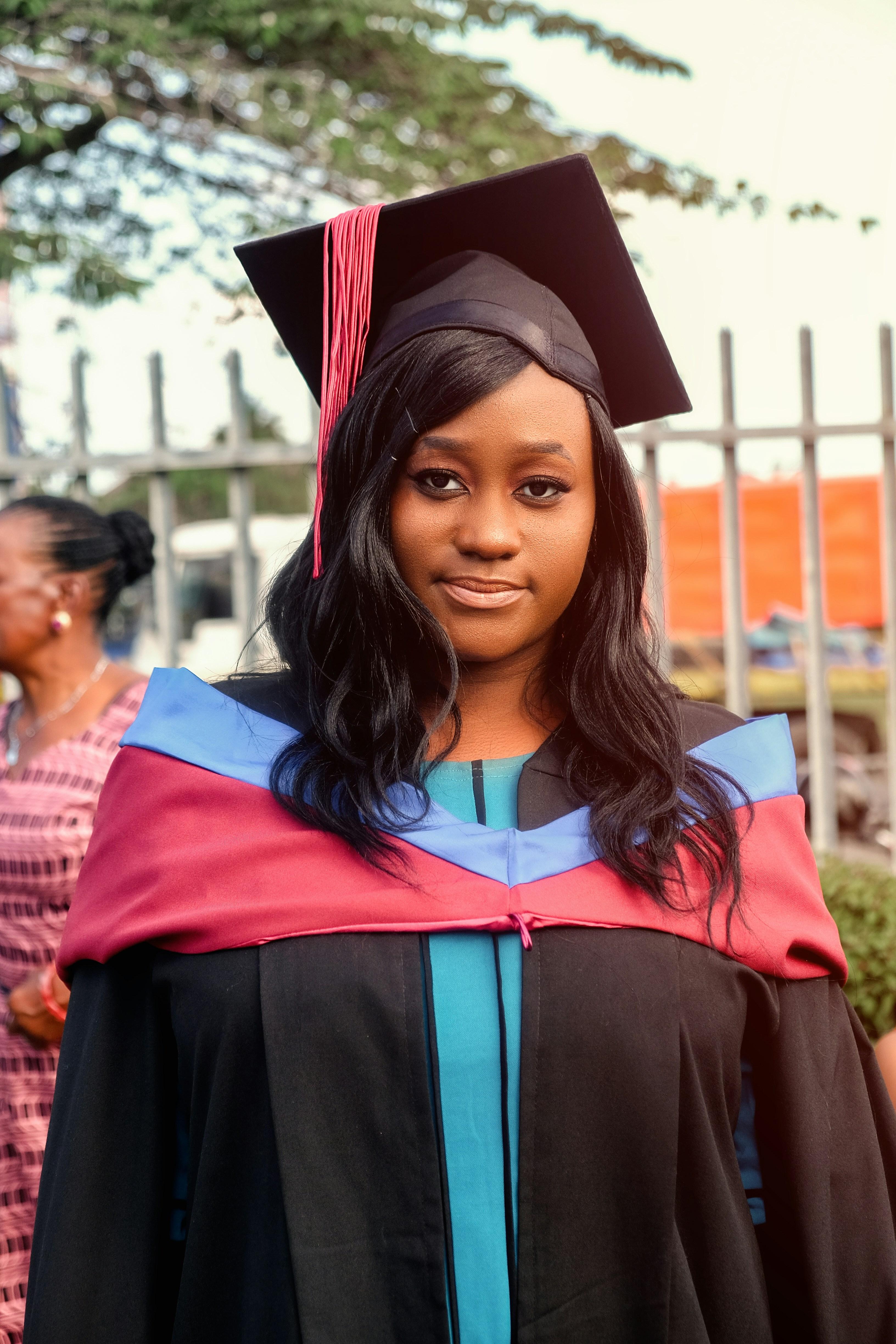 Portrait of smiling female student in graduation attire