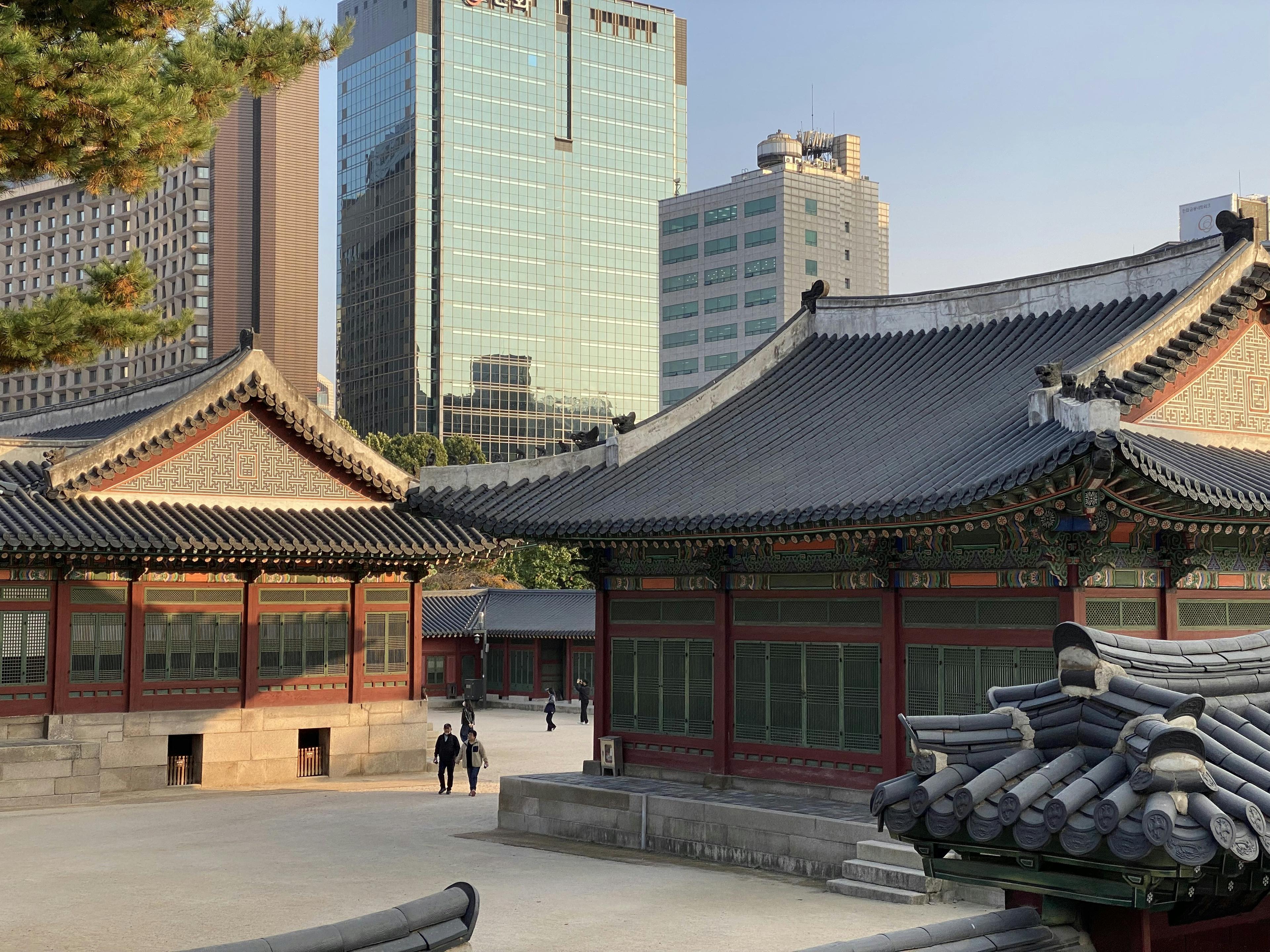 Seoul cityscape with Namsan Tower, modern skyscrapers, and traditional architecture blend