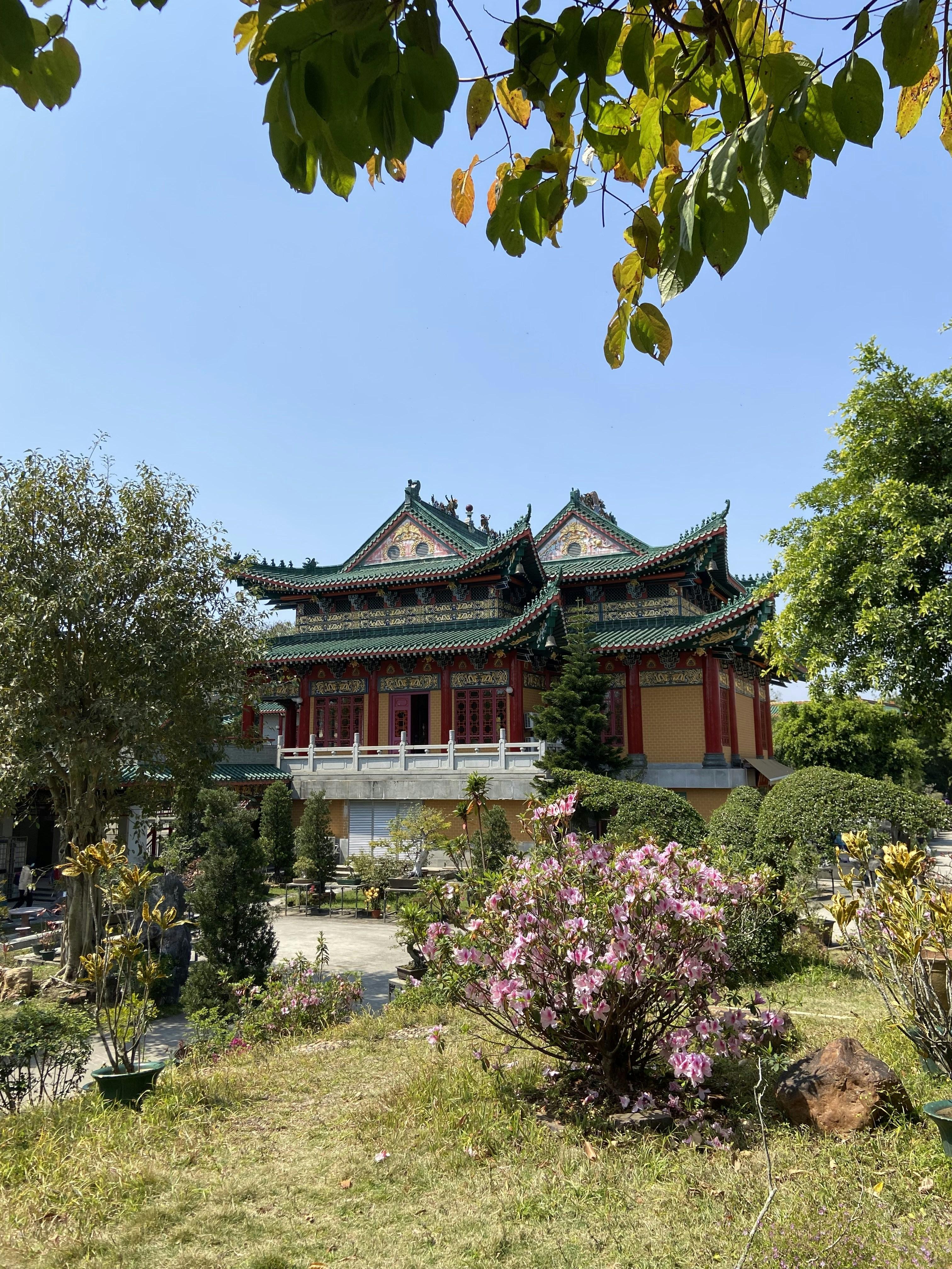 Historic university building with traditional Chinese garden