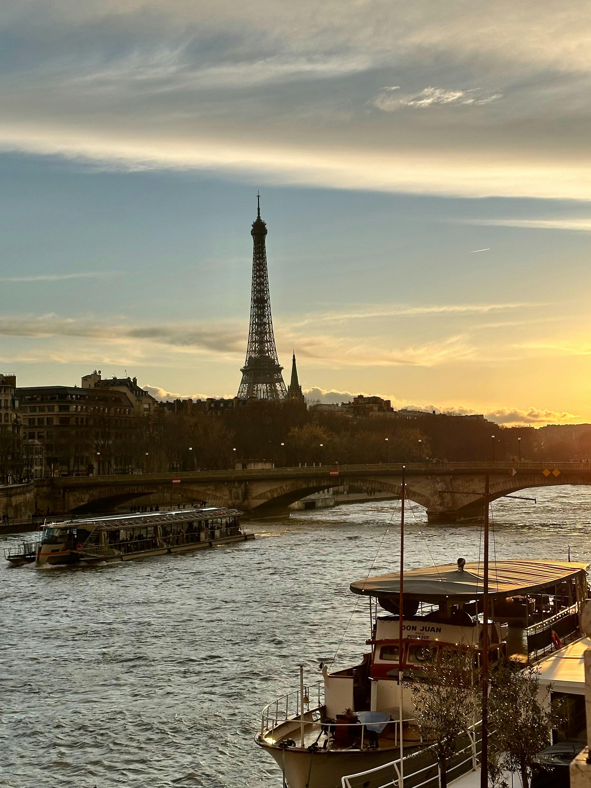 Eiffel Tower in Paris with Seine River and historic buildings during golden hour